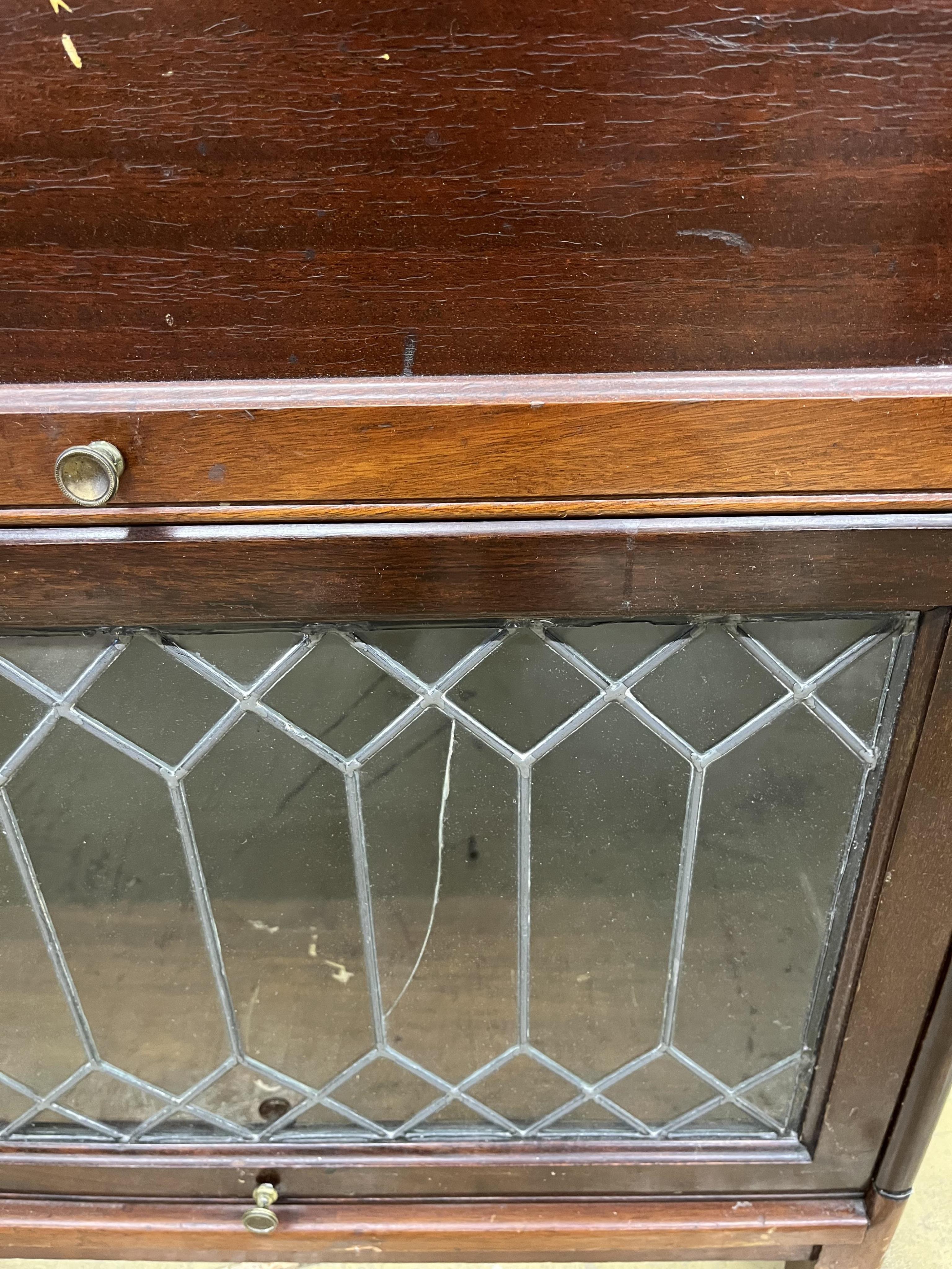 A narrow Globe Wernicke style mahogany four section bookcase, width 66cm, depth 31cm, height 156cm